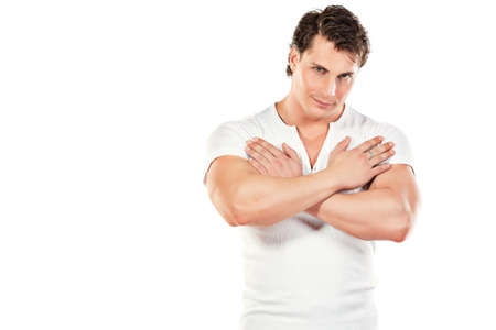 Portrait of a handsome muscular young man. Isolated over white background.の写真素材