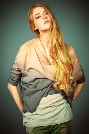 Portrait of an attractive young woman in jeans clothing. の写真素材