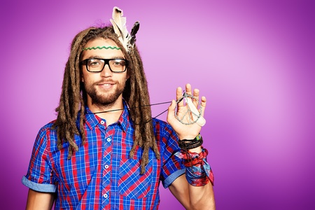 Portrait of a hippie young man in spectacles.の写真素材