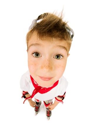 Portrait of a cute smiling boy in roller skates. Isolated over white.の写真素材