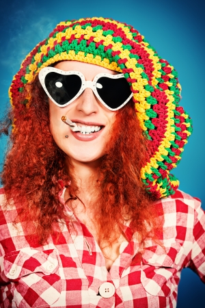 Portrait of a smiling rastafarian girl.の写真素材