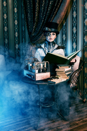 Portrait of a beautiful steampunk woman over vintage background.の写真素材