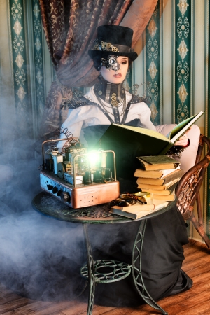 Portrait of a beautiful steampunk woman over vintage background.の写真素材