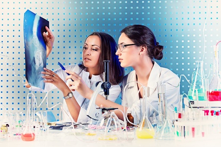 Surgical staff of the hospital are studying x-ray image. Laboratory equipment.の写真素材