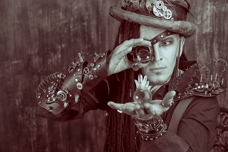 Portrait of a steampunk man over grunge background.の写真素材