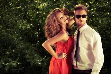 Beautiful modern couple standing outdoor.の写真素材