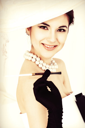 Close-up art fashion photo of a gorgeous woman in paper dress. Black and white.