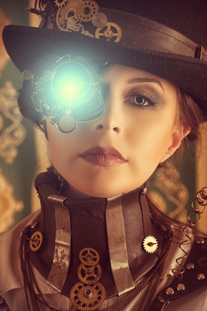 Portrait of a beautiful steampunk woman over vintage background.の写真素材
