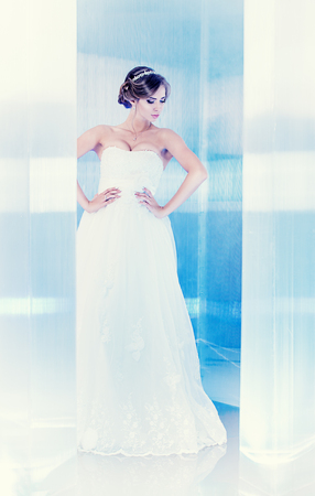 Full length portrait of a beautiful charming bride. の写真素材