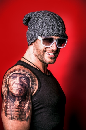 Portrait of a handsome brutal man. Street style. の写真素材