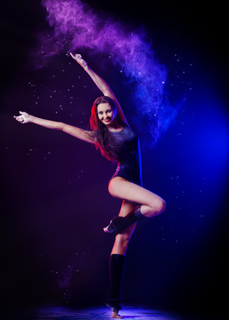 Beautiful expressive ballet dancer dancing at studioの写真素材