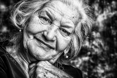 Portrait of a beautiful smiling senior woman. の写真素材