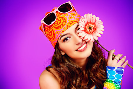 Cheerful teenager girl in bright casual clothes smiling at the camera. の写真素材