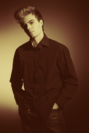 Portrait of a handsome young man posing at studio. の写真素材