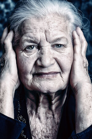 Portrait of a beautiful smiling senior woman. の写真素材