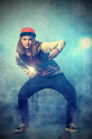 Modern hip-hop dancer over grunge background.