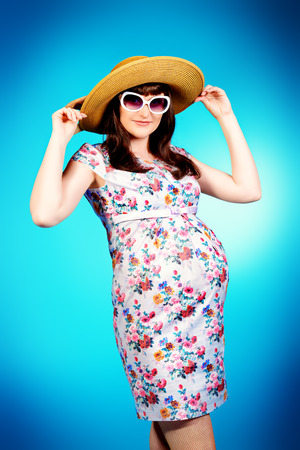 Portrait of a beautiful pregnant woman. Pregnancy. Healthcare. Studio shot.の写真素材