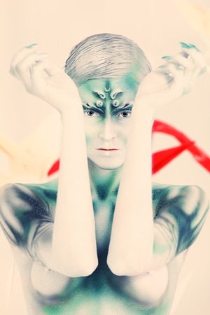 Art project: expressive young woman with beautiful painted body. の写真素材