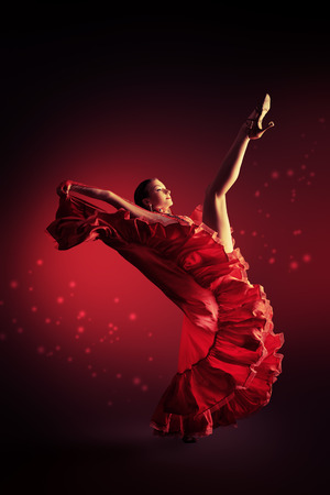Beautiful professional dancer performs latino dance. Passion and expression.の写真素材