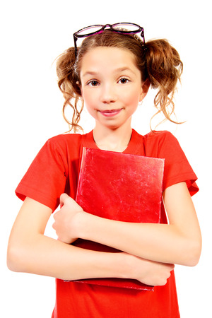 Portrait of a pretty ten years girl in spectacles looking at camera. Isolated over white.の写真素材