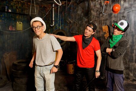 Group of cool guys hang out in the garage. Hip-hop style. の写真素材