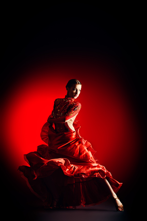 Beautiful professional dancer performs latino dance. Passion and expression.の写真素材