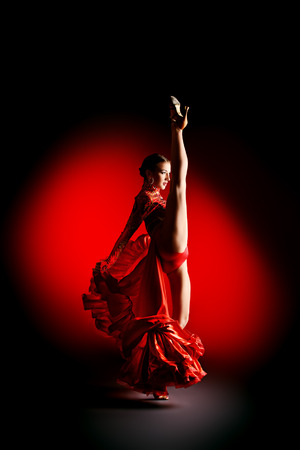 Beautiful professional dancer performs latino dance. Passion and expression.の写真素材