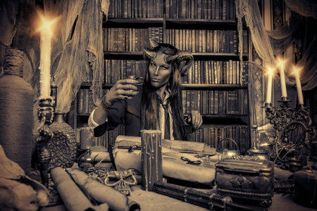 Horned Devil in his home. Fantasy. Ancient style. Halloween. Black-and-white photo.の写真素材