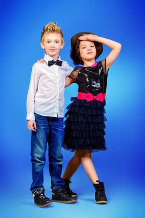 Full length portrait of two modern kids posing together. Fashion shot.  の写真素材