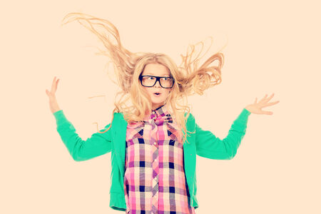 Emotional ten years girl in big glasses. Education. Isolated over white.の写真素材