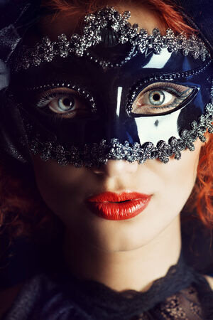 Beautiful elegant woman in carnival mask.の写真素材
