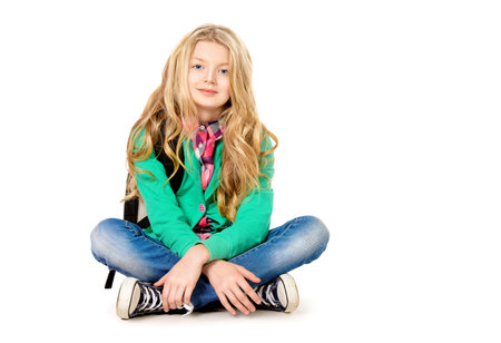 Cute ten years girl wearing casual clothes. Isolated over white.の写真素材