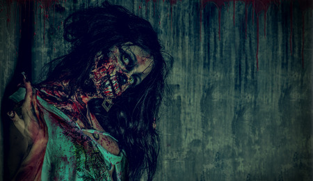 Close-up portrait of a scary bloody zombie girl. Horror. Halloween.の写真素材