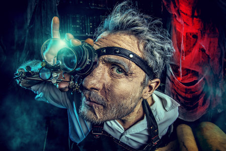 Portrait of a crazy medieval scientist working in his laboratory. Alchemist. Halloween.の写真素材