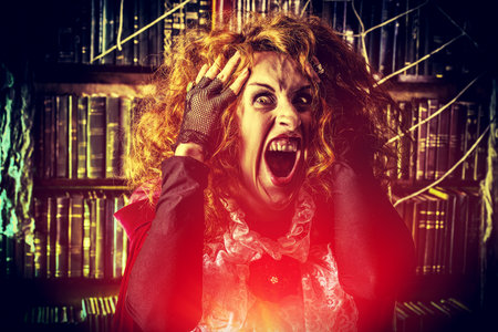 Portrait of a crazy funny witch in the wizarding lair. Fairytales. Halloween.