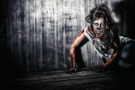 Furious bloody zombie girl. Horror. Halloween.の写真素材