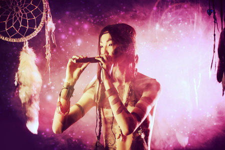 Portrait of the American Indian playing flute.