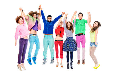 Large group of cheerful young people jumping for joy. Isolated over white.の写真素材