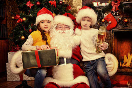 Santa Claus brought gifts for children. Christmas scene.の写真素材