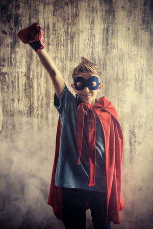 A boy teenager in a costume of superhero.の写真素材