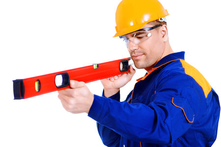 A construction worker working with building level. Job, occupation. Isolated over white.