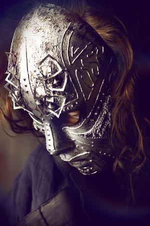 Portrait of a mysterious man in iron mask. Steampunk. Fantasy. Halloween.の写真素材