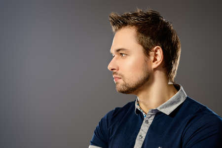 Profile portrait of a handsome young man. Men's beauty.の写真素材