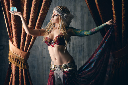 Beautiful traditional female dancer. Ethnic dance. Belly dancing. Tribal dancing.の写真素材