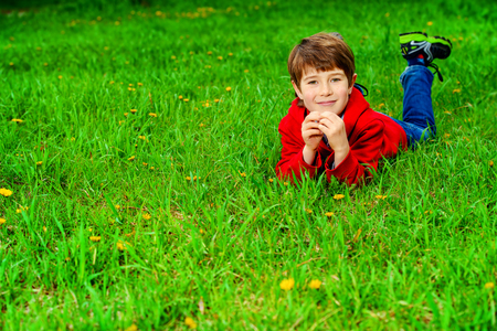 Cute 7 years old boy having fun outdoor. Summer day.の写真素材