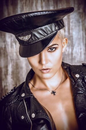 Attractive young woman alluring in a costume of police officer.の写真素材