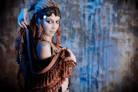 Art portrait of a beautiful traditional female dancer. Ethnic dance. Belly dancing. Tribal dancing.