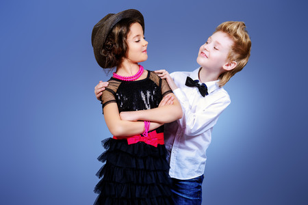 Two modern kids posing together. Fashion shot.の写真素材