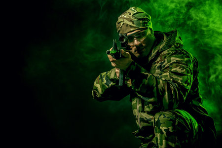 Brave soldier in camouflage holding automatic rifle. Military.