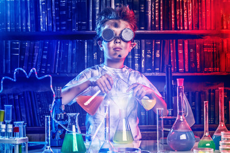 A boy doing experiments in the laboratory. Explosion in the laboratory. Science and education.の写真素材